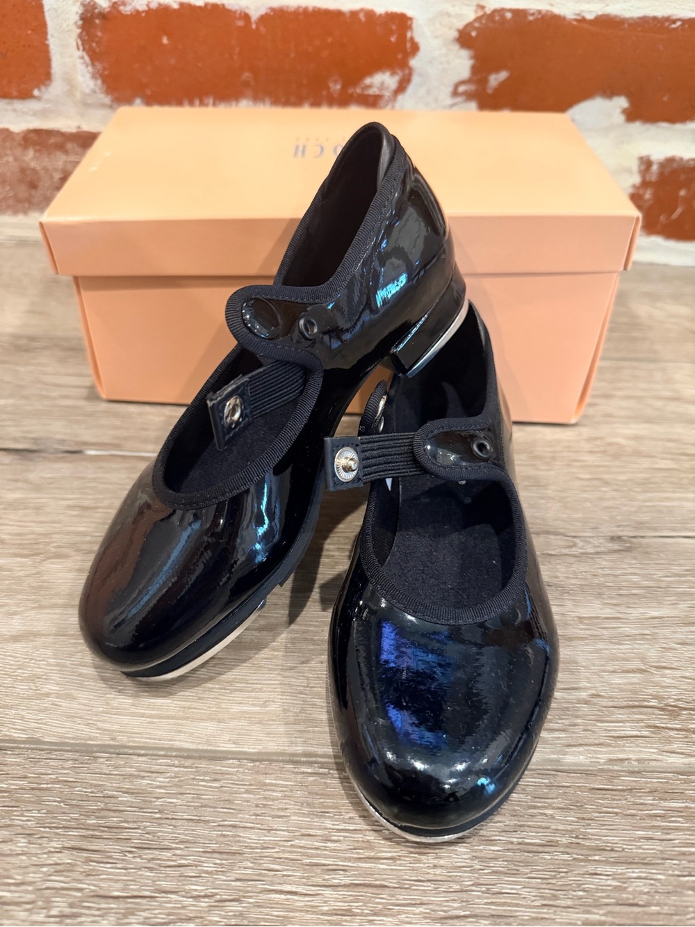 Black Patent tap shoes with Button Strap. Comes with shoelace to make bow